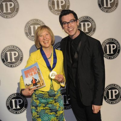 IPPY author Franke James at the IPPY award ceremony with her book and IPPY medal